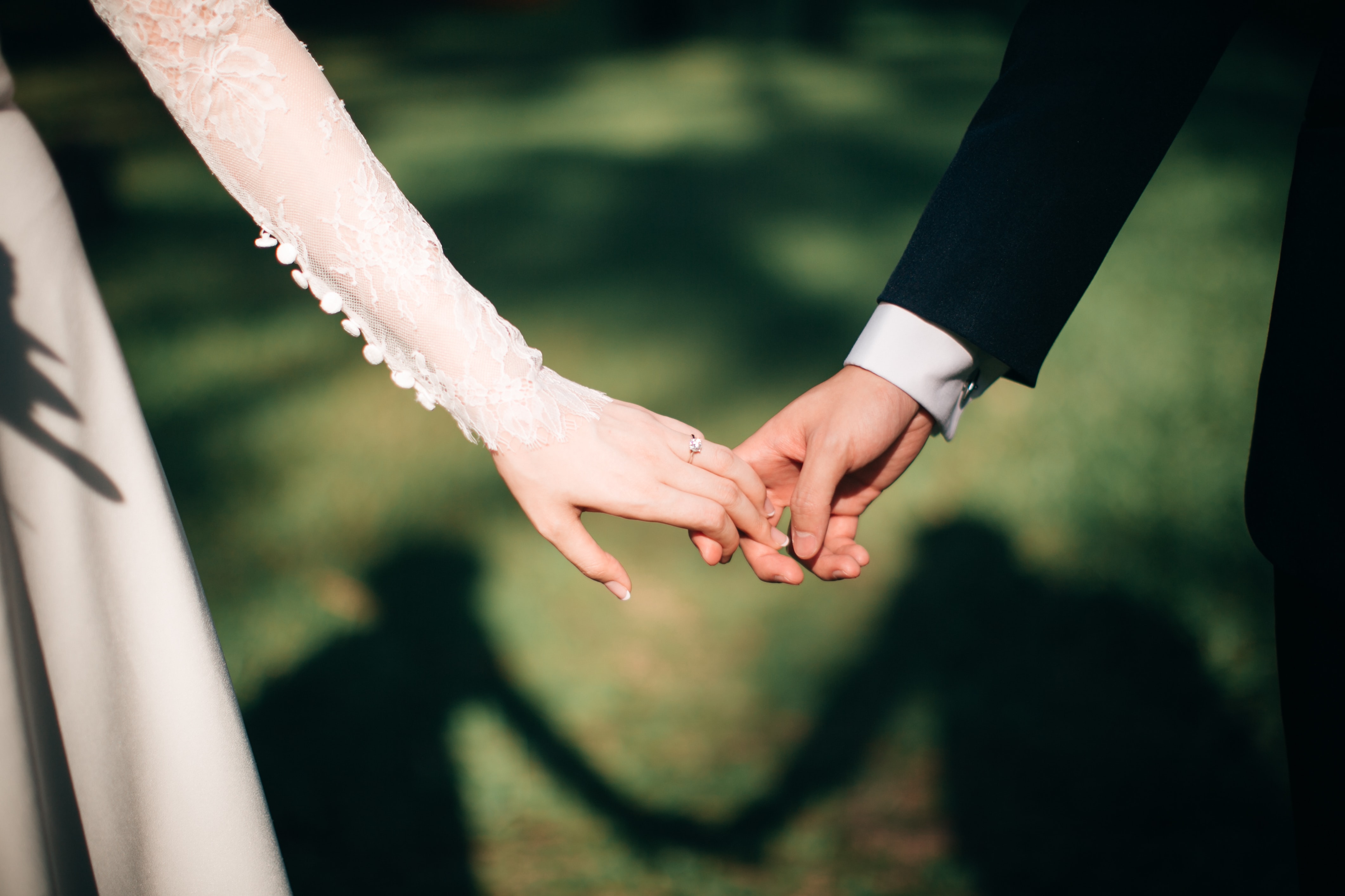 A bride and groom holding hands