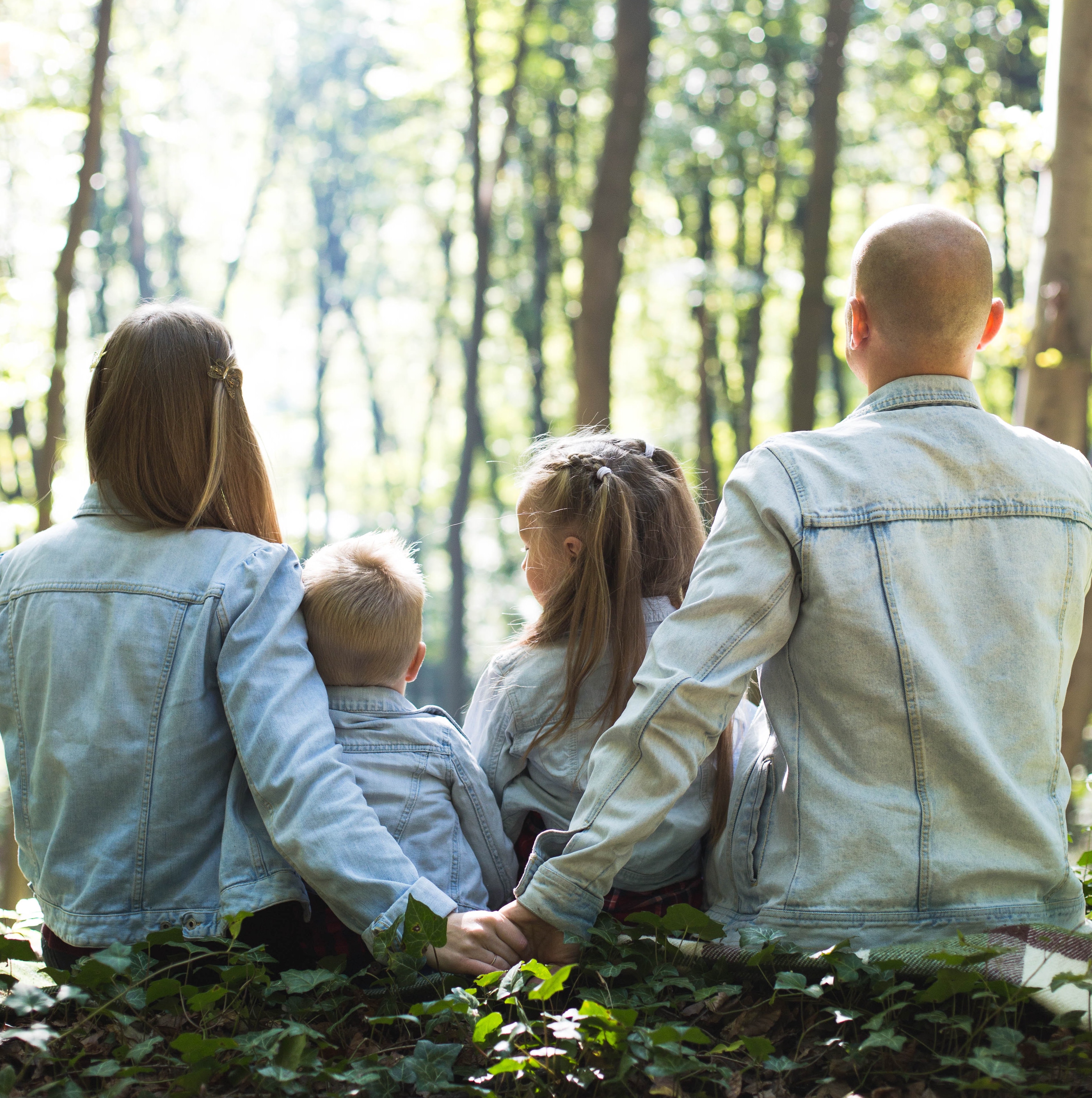 Family of 4 looking off into the distance.