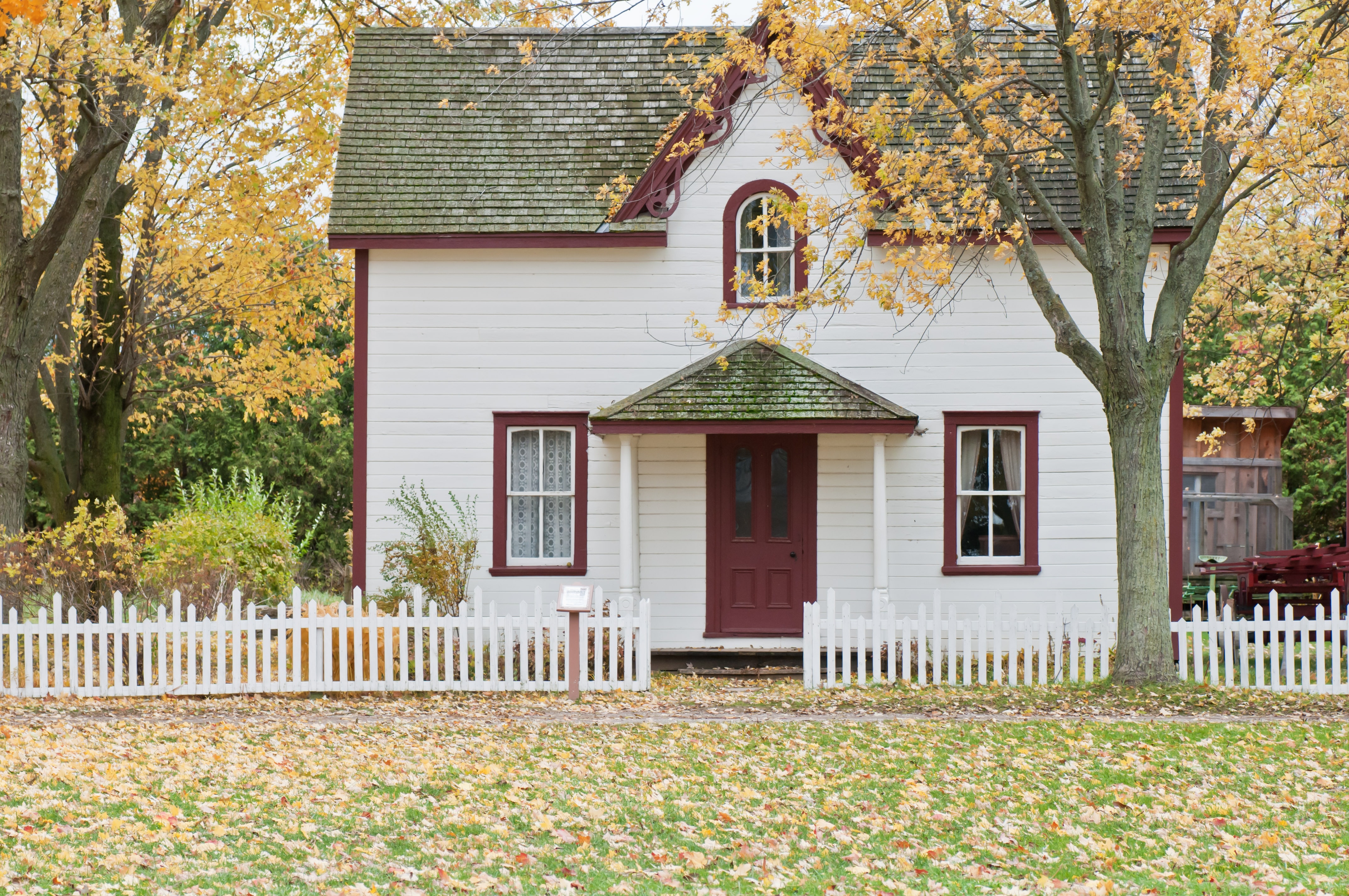 A white house with a picket fence