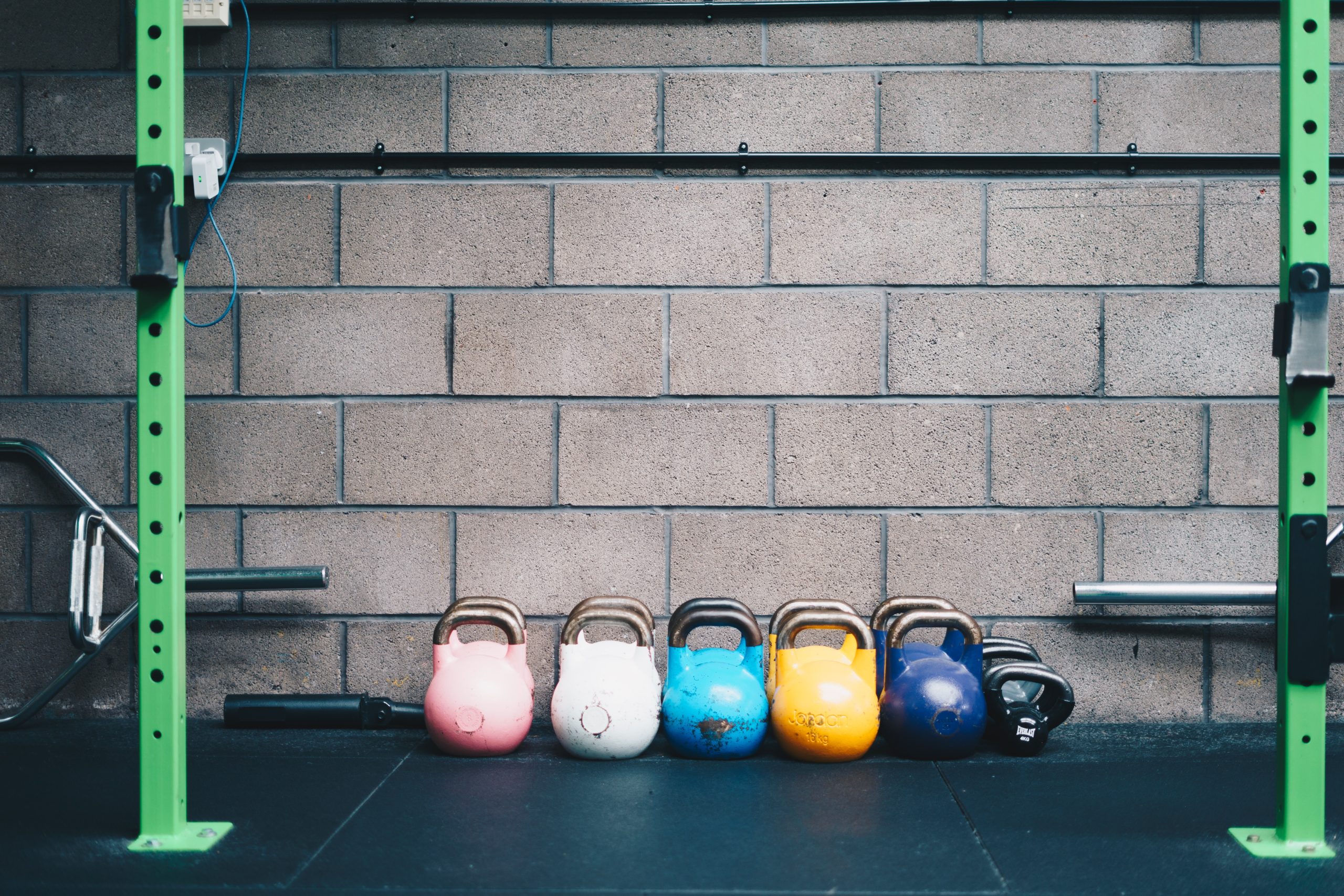 A bunch of workout gear in a gym.