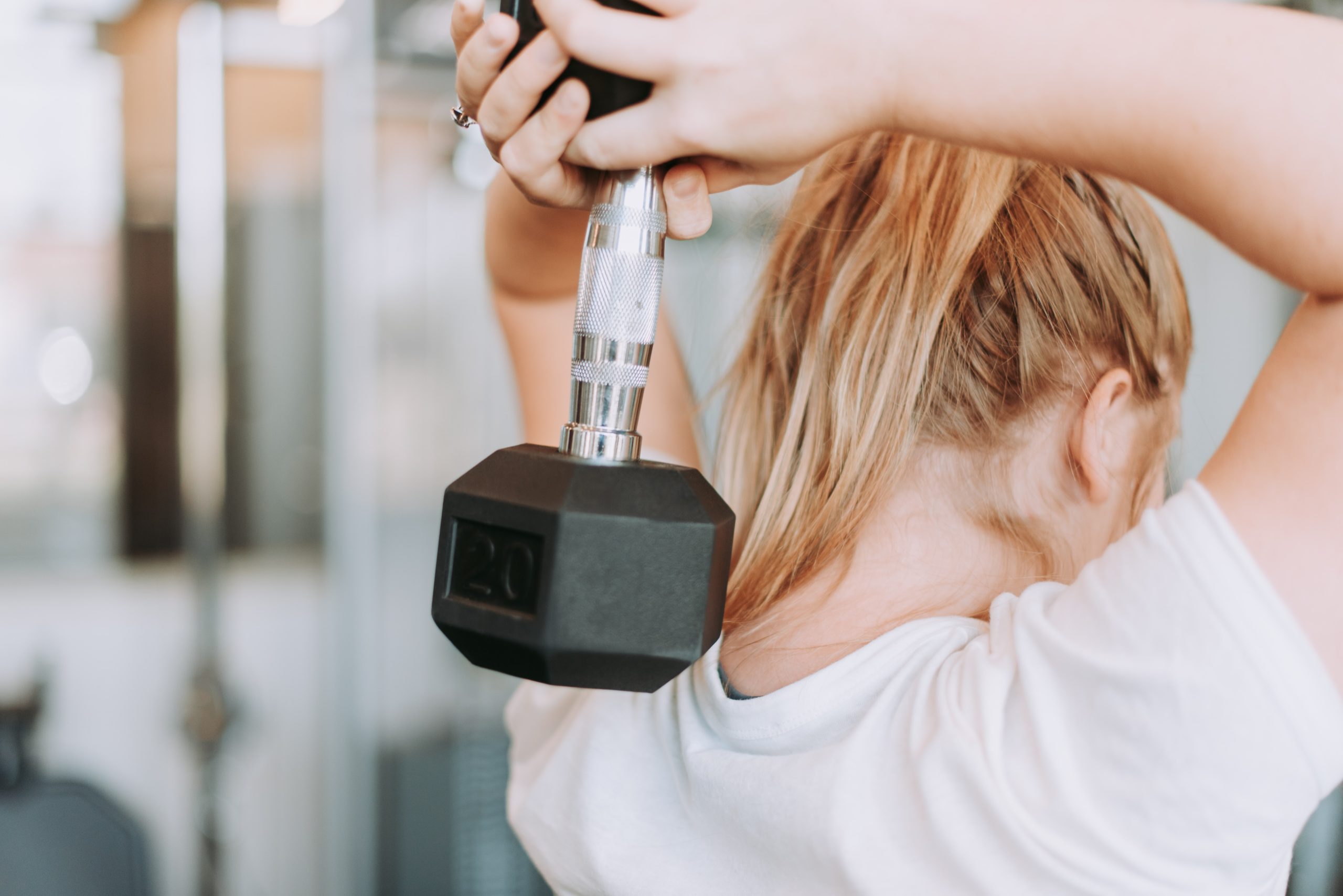 A Woman Lifting a Weight